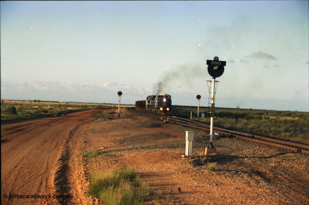 224-31
Bing siding, the afternoon empty to Yandi was a staple of the AC6000 units when delivered, operating the train as a pair, 112 waggons, AC6000 and 112 waggons. 6076 'Mt Goldsworthy' serial 51068 a General Electric AC6000 built by GE at Erie departs the loop south with sister unit 6073. [url=https://goo.gl/maps/KQrczNpVhAH2]GeoData[/url].
