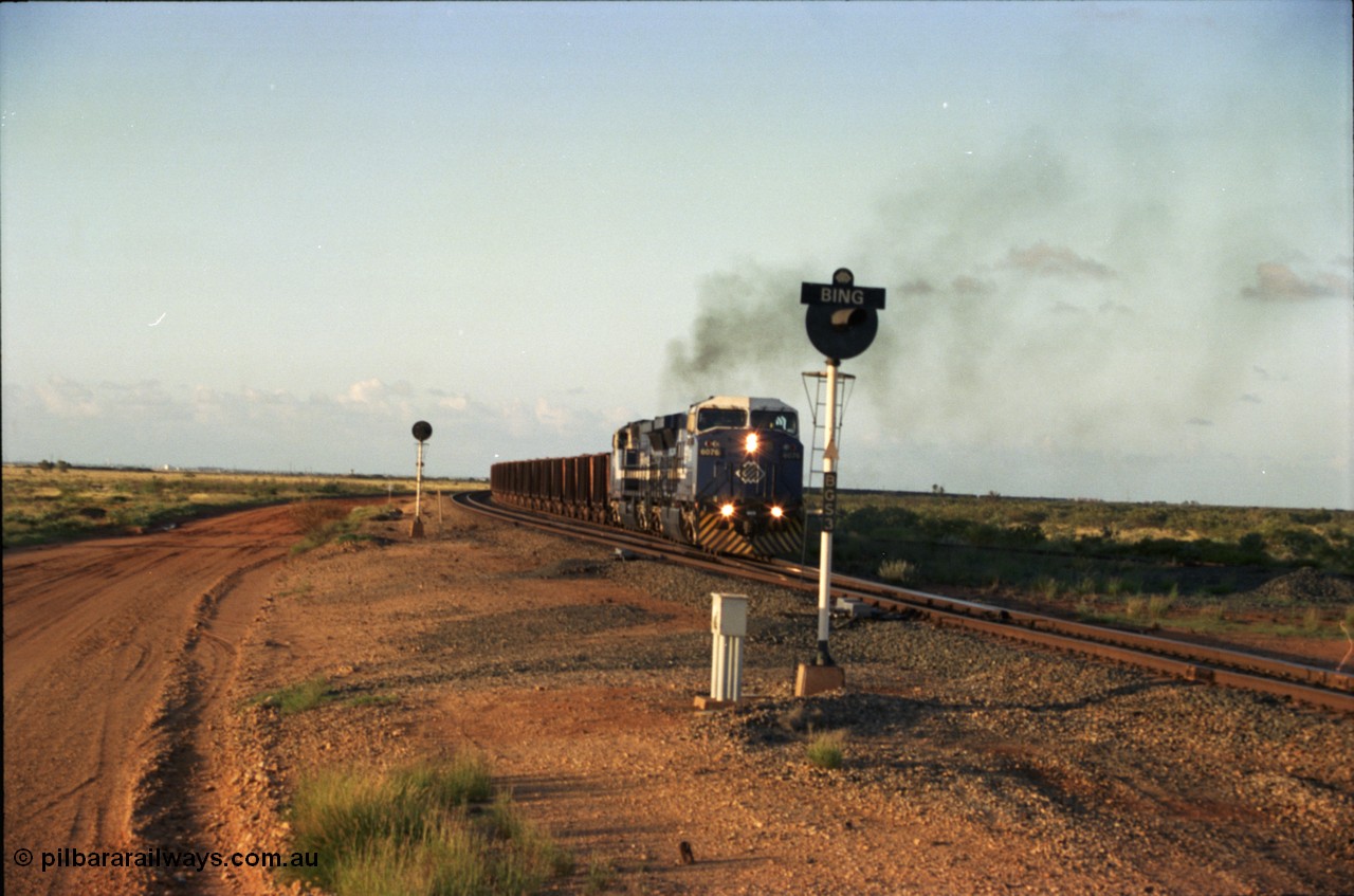 224-32
Bing siding, the afternoon empty to Yandi was a staple of the AC6000 units when delivered, operating the train as a pair, 112 waggons, AC6000 and 112 waggons. 6076 'Mt Goldsworthy' serial 51068 a General Electric AC6000 built by GE at Erie departs the loop south with sister unit 6073. [url=https://goo.gl/maps/KQrczNpVhAH2]GeoData[/url].
Keywords: 6076;GE;AC6000;51068;