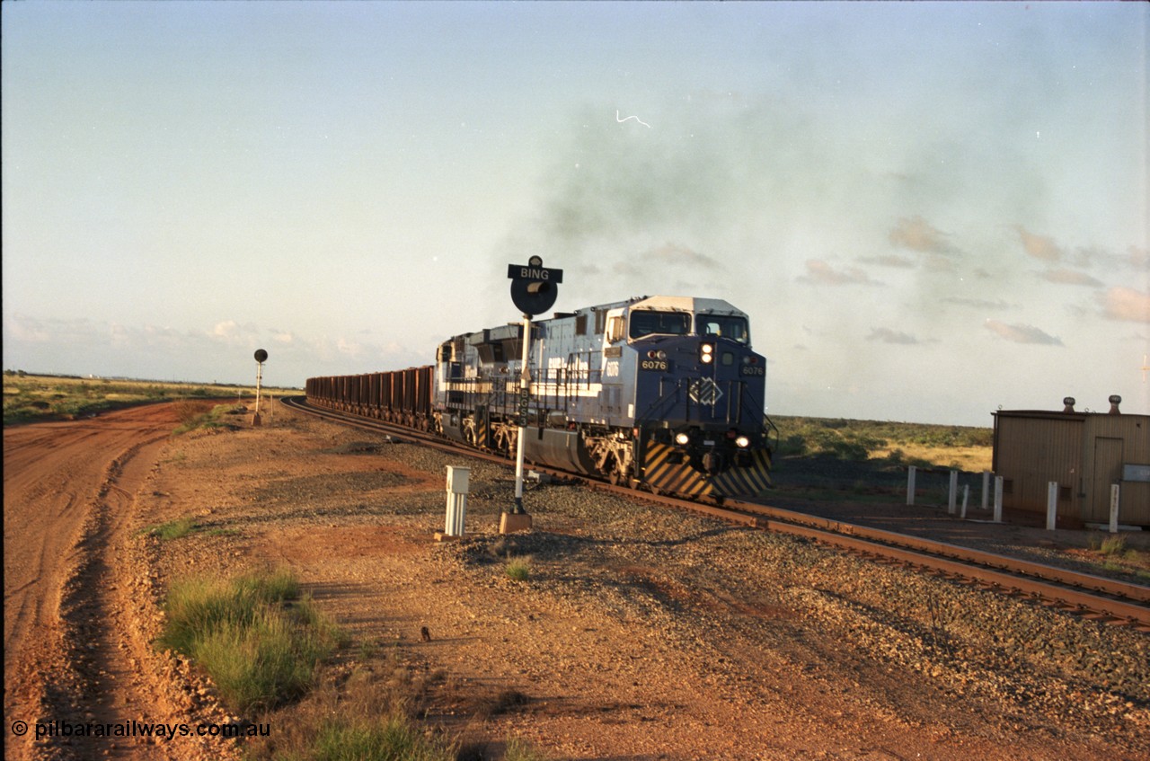 224-33
Bing siding, the afternoon empty to Yandi was a staple of the AC6000 units when delivered, operating the train as a pair, 112 waggons, AC6000 and 112 waggons. 6076 'Mt Goldsworthy' serial 51068 a General Electric AC6000 built by GE at Erie departs the loop south with sister unit 6073. [url=https://goo.gl/maps/KQrczNpVhAH2]GeoData[/url].
Keywords: 6076;GE;AC6000;51068;