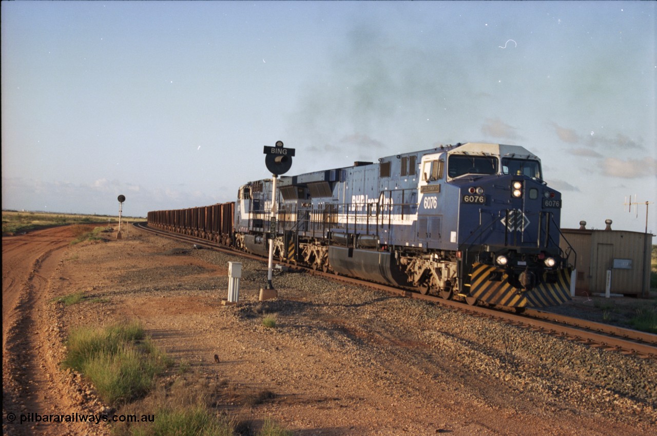 224-34
Bing siding, the afternoon empty to Yandi was a staple of the AC6000 units when delivered, operating the train as a pair, 112 waggons, AC6000 and 112 waggons. 6076 'Mt Goldsworthy' serial 51068 a General Electric AC6000 built by GE at Erie departs the loop south with sister unit 6073. [url=https://goo.gl/maps/KQrczNpVhAH2]GeoData[/url].
Keywords: 6076;GE;AC6000;51068;