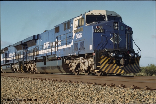 224-03
Bing siding, the afternoon empty to Yandi was a staple of the AC6000 units when delivered, operating the train as a pair, 112 waggons, AC6000 and 112 waggons. 6076 'Mt Goldsworthy' serial 51068 a General Electric AC6000 built by GE at Erie awaits the road to depart south. [url=https://goo.gl/maps/KQrczNpVhAH2]GeoData[/url].
Keywords: 6076;GE;AC6000CW;51068;