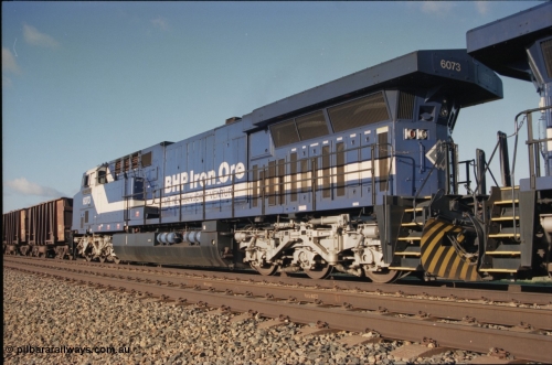 224-14
Bing siding, 6073 'Fortescue' serial 51065 a General Electric AC6000 built by GE at Erie awaits the road to depart south, radiator, steerable bogie and taper in cab side. [url=https://goo.gl/maps/KQrczNpVhAH2]GeoData[/url].
Keywords: 6073;GE;AC6000CW;51065;