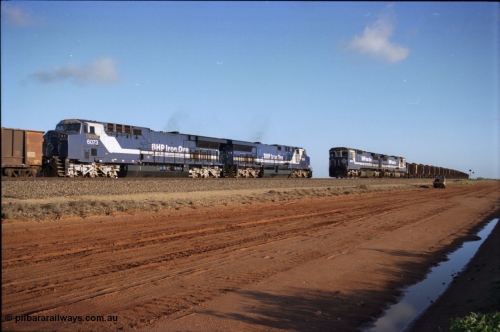 224-24
Bing siding, the afternoon empty to Yandi was a staple of the AC6000 units when delivered, operating the train as a pair, 112 waggons, AC6000 and 112 waggons. 6076 'Mt Goldsworthy' serial 51068 a General Electric AC6000 built by GE at Erie awaits the road to depart south with sister unit 6073 as a loaded behind two CM40-8M units rolls through on the mainline. [url=https://goo.gl/maps/KQrczNpVhAH2]GeoData[/url].
Keywords: 6073;GE;AC6000CW;51065;