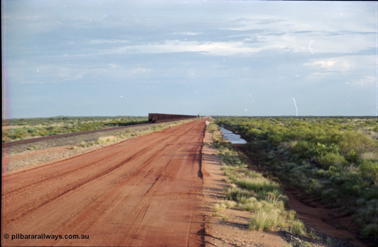 225-26
24.1 km grade crossing on the Newman line, empty train racing off into the distance. [url=https://goo.gl/maps/qGkyfiuy6212]GeoData[/url].
