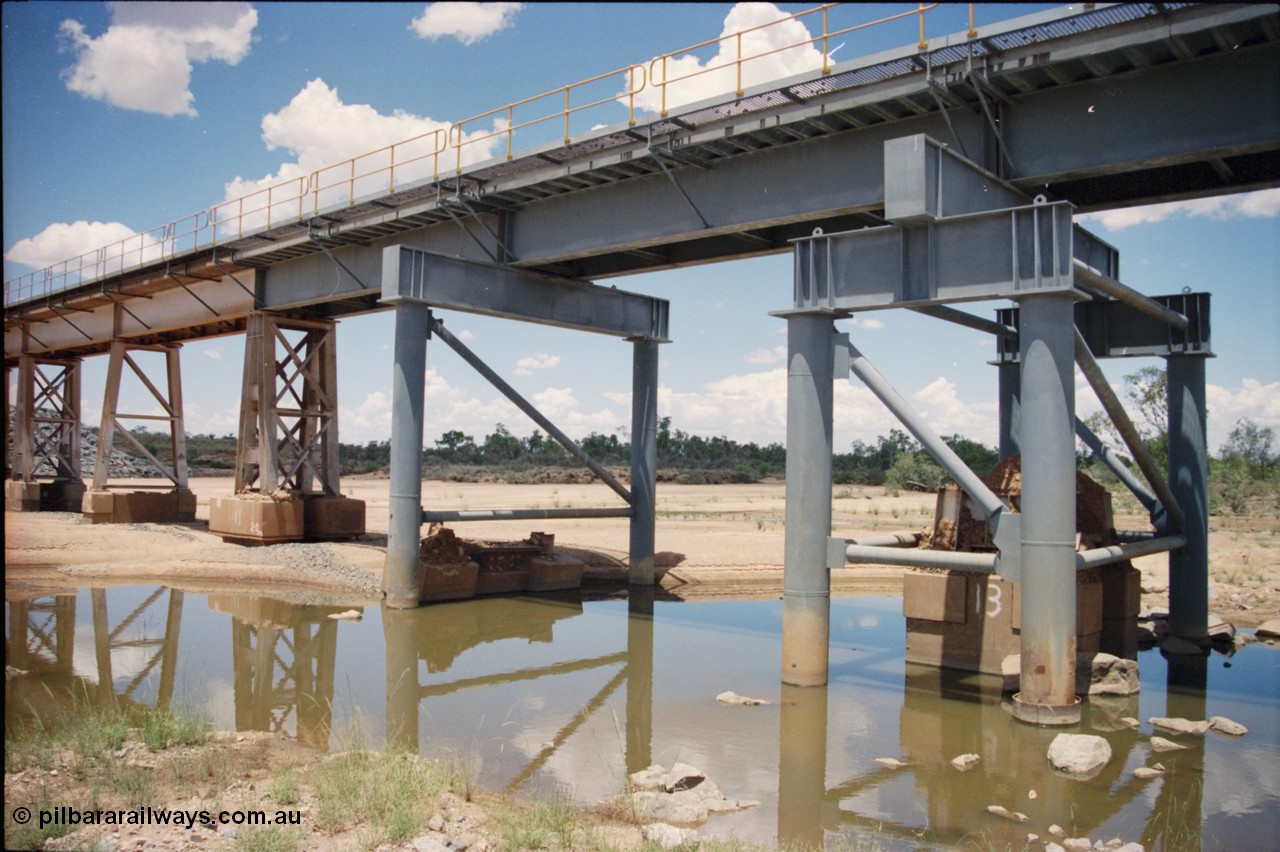 226-02
Yule River bridge showing new piles and deck to replace flood damaged piles after a cyclone that closed the line for two weeks in the late 1990s. [url=https://goo.gl/maps/G67Mat23u4P2]GeoData[/url].
