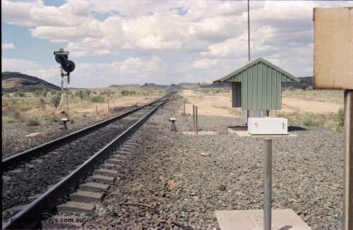 226-11
Garden Siding looking north from the south end. Signal post with dual heads, GNS 3 and GNS 3R which is a repeater signal aimed up the hill for loaded trains running down grade. The small units each side of the mainline is a Cold Wheel Detector. As the trains are running down a 5 km long 1.5 percent grade the trains are under dynamic and train brake control to maintain the train speed below the limit. [url=https://goo.gl/maps/GhqKW3xWJPq]GeoData[/url].
