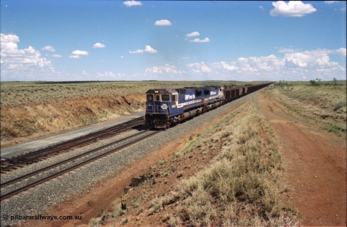 226-27
Shaw siding at the 219 km a loaded train with power from two Goninan CM40-8M GE rebuild units 5642 'Wallareenya' serial 8281-07 / 92-131 and sister unit 5636, the mid-train remotes can be seen in the distance topping the grade. [url=https://goo.gl/maps/JLjSYskHScU2]GeoData[/url].
Keywords: 5642;Goninan;GE;CM40-8M;8281-07/92-131;rebuild;AE-Goodwin;ALCo;C636;5467;G6041-3;