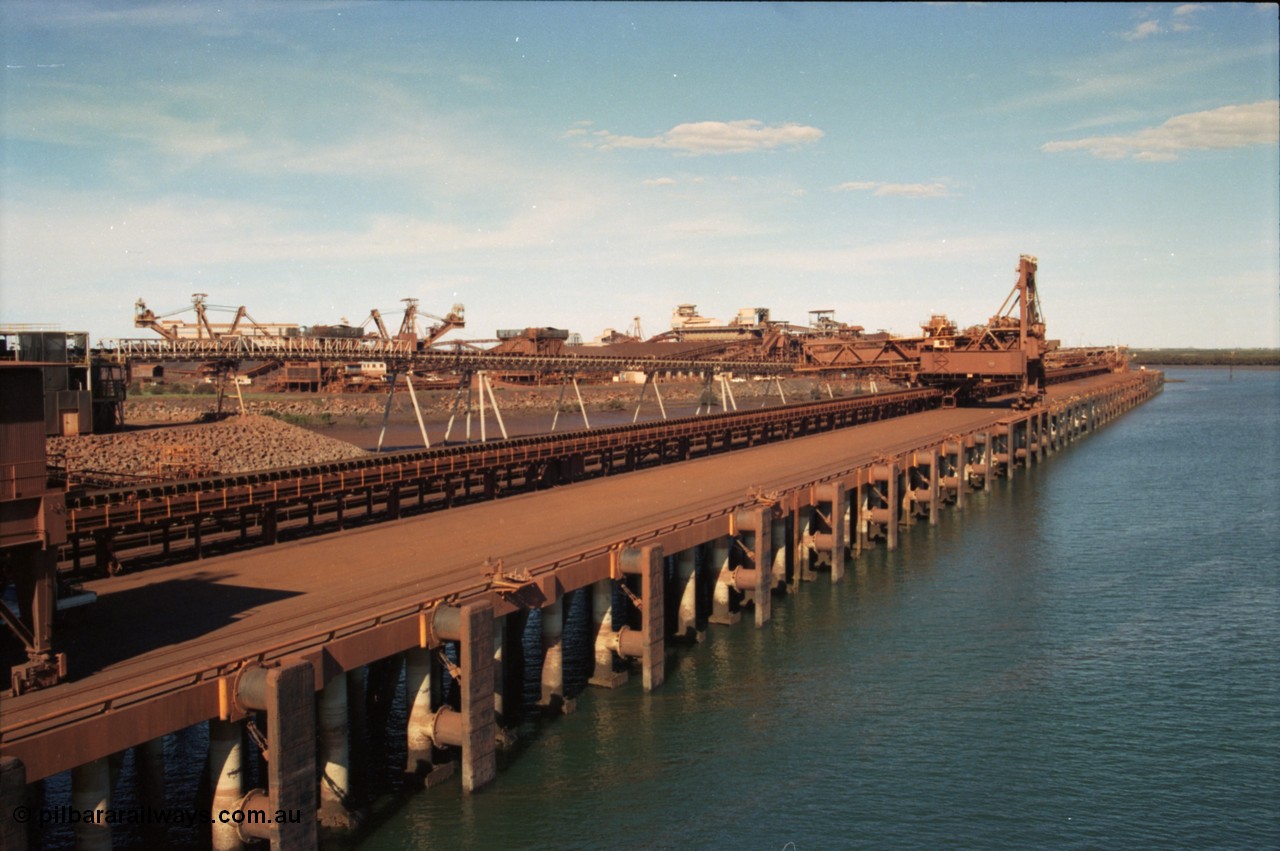 227-03
Nelson Point, view along A and B berths from Shiploader 2, Shiploader 1 on B berth, reclaimers 3 and 4 visible behind the under harbour tunnel feed conveyor. [url=https://goo.gl/maps/9YFk9Z8c7WG2]GeoData[/url].
