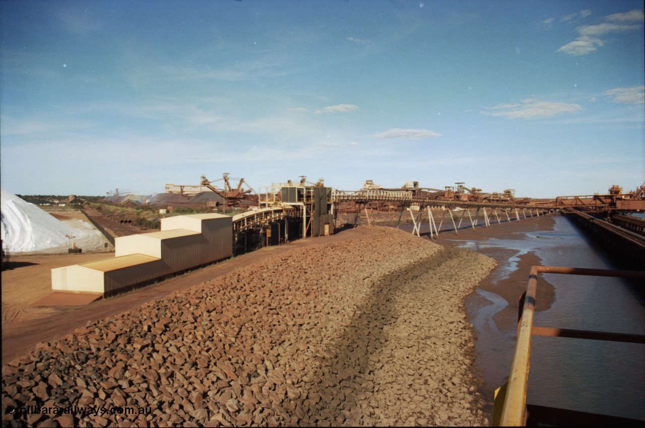 227-08
Nelson Point, view along the rear of A and B berths from Shiploader 2, salt pile on the left, then the under harbour tunnel portal, old reclaimers 3 and 4 with the crushing building in the distance, which has now been demolished, and the rear of Shiploader 1 on B berth. [url=https://goo.gl/maps/1sLxDMF5tZu]GeoData[/url].
