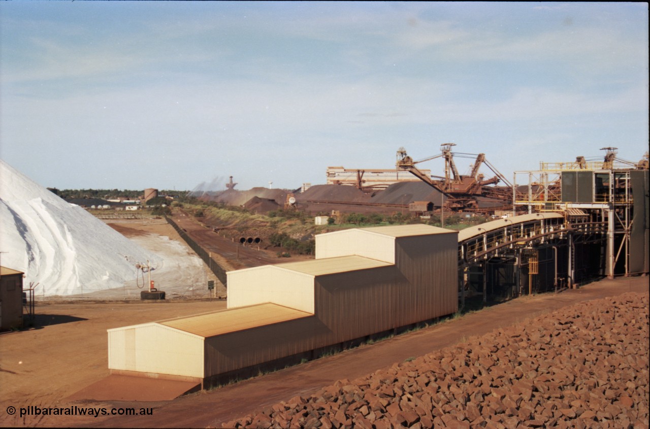 227-12
Nelson Point, view from rear of Shiploader 2, salt pile, manganese stockpile in the distance, stacker 3, the Port Hedland water tower, then 101-102 sample station and Tertiary Crushing Building One or TCB1, stacker 4 and reclaimer 3 with the under harbour portal in the foreground. [url=https://goo.gl/maps/1sLxDMF5tZu]GeoData[/url].
