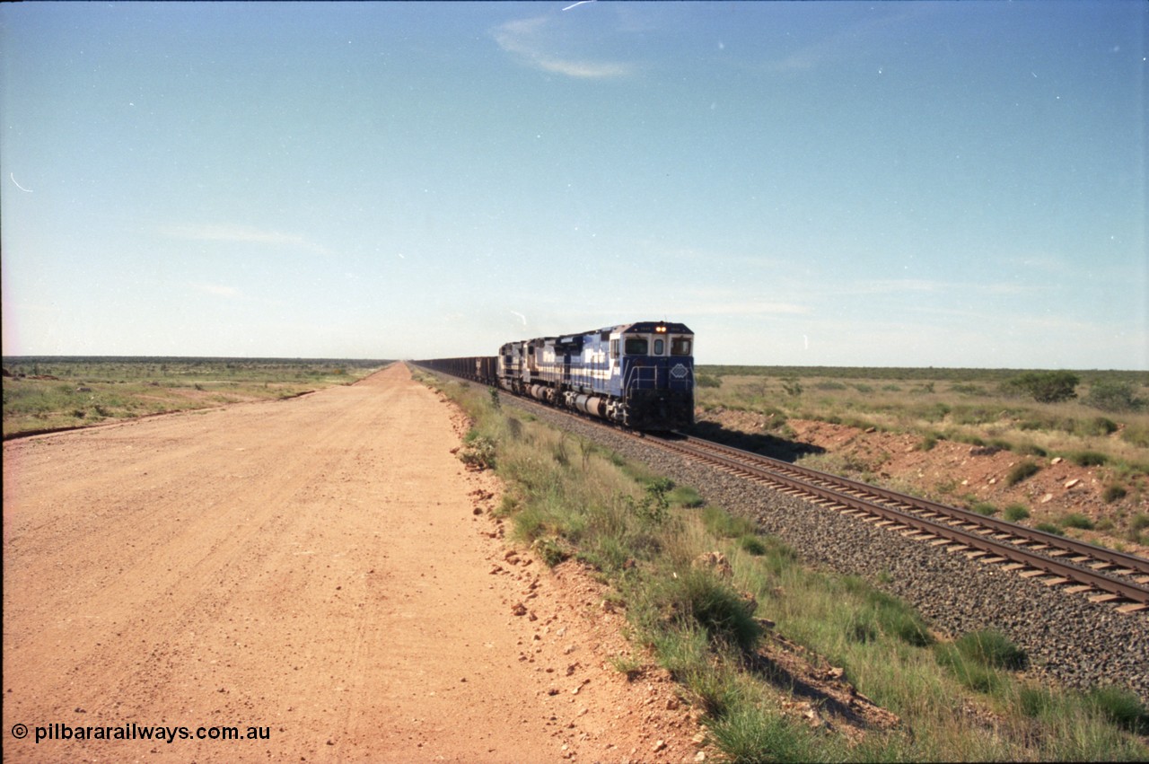 227-22
30 km area on the Newman mainline, east of the original Quarry 1, an empty train powers along the gentle .17% rising grade behind Goninan CM40-8M GE rebuilds 5649 'Pohang' serial 8412-07/93-140 and 5651 with third unit an General Electric AC6000. [url=https://goo.gl/maps/BY7Zz4F5t822]GeoData[/url].
Keywords: 5649;Goninan;GE;CM40-8M;8412-07/93-140;rebuild;AE-Goodwin;ALCo;M636C;5473;G6047-5;