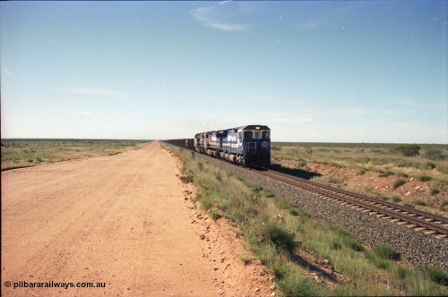 227-22
30 km area on the Newman mainline, east of the original Quarry 1, an empty train powers along the gentle .17% rising grade behind Goninan CM40-8M GE rebuilds 5649 'Pohang' serial 8412-07/93-140 and 5651 with third unit an General Electric AC6000. [url=https://goo.gl/maps/BY7Zz4F5t822]GeoData[/url].
Keywords: 5649;Goninan;GE;CM40-8M;8412-07/93-140;rebuild;AE-Goodwin;ALCo;M636C;5473;G6047-5;