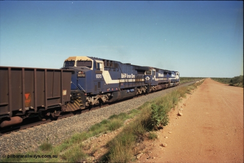 227-25
30 km area, third unit on an empty ore train is class leader 6070 'Port Hedland' serial 51062 a General Electric AC6000 built by GE Erie. [url=https://goo.gl/maps/BY7Zz4F5t822]GeoData[/url].
Keywords: 6070;GE;AC6000CW;51062;