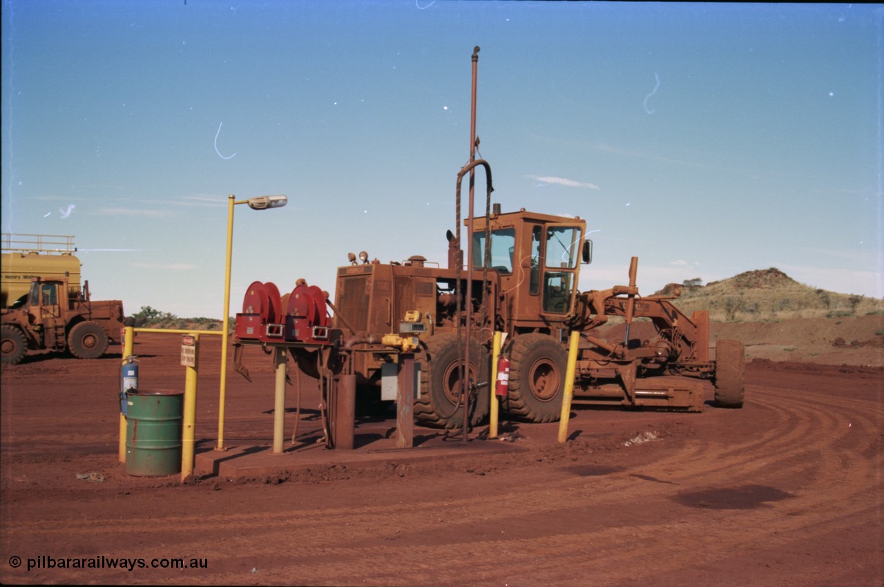 228-07
Yandi Two mobile machine fuel point. A Caterpillar 16G road motor grader is receiving attention.
Keywords: Caterpillar;16G;