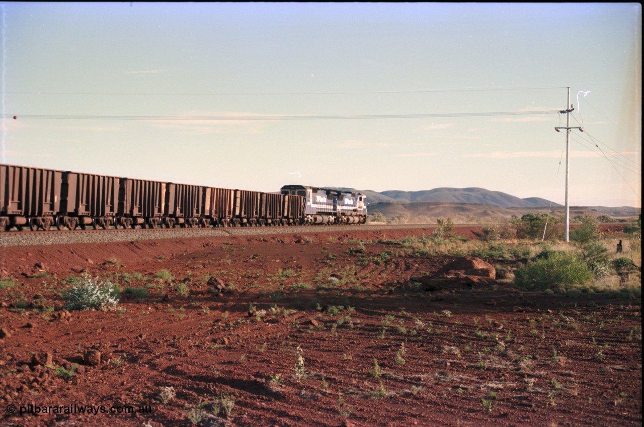 228-21
Yandi Two branch, trailing shot of the afternoon empty train heading west to the load-out behind a standard pair of Goninan rebuilt GE CM40-8M model units 5649 'Pohang' serial 8412-07/93-140 and 5644 'Kangan' serial 8281-09/92-133. Geodata [url=https://goo.gl/maps/S1bX3ycGXqE2] -22.706976, 119.097651 [/url].
Keywords: 5649;Goninan;GE;CM40-8M;8412-07/93-140;rebuild;AE-Goodwin;ALCo;M636C;5473;G6047-5;