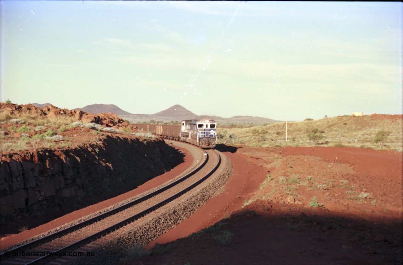 228-26
Yandi Two balloon loop, the afternoon empty train arrives at the load-out tunnel behind a standard pair of Goninan rebuilt GE CM40-8M model units 5649 'Pohang' serial 8412-07/93-140 and 5644 'Kangan' serial 8281-09/92-133. Geodata [url=https://goo.gl/maps/KbzBN9Bt4k52] -22.720824, 119.043410 [/url].
Keywords: 5649;Goninan;GE;CM40-8M;8412-07/93-140;rebuild;AE-Goodwin;ALCo;M636C;5473;G6047-5;