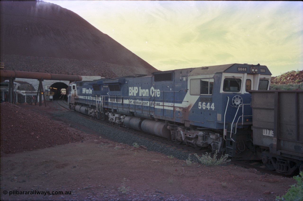 228-30
Yandi Two load-out tunnel, trailing view of empty train about to enter for loading behind a standard pair of Goninan rebuilt GE CM40-8M model units 5649 'Pohang' serial 8412-07/93-140 and 5644 'Kangan' serial 8281-09/92-133. Geodata [url=https://goo.gl/maps/KbzBN9Bt4k52] -22.720824, 119.043410 [/url].
Keywords: 5644;Goninan;GE;CM40-8M;8281-09/92-133;rebuild;AE-Goodwin;ALCo;M636C;5471;G6047-3;