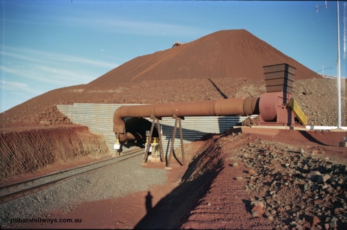 228-32
Yandi Two exit portal or loaded car side of load-out tunnel, stacker tip just visible above stock pile, the Yandi Two load-out has two load-out stations or vaults to allow to different products to be loaded. Only one vault is active at a time. Geodata [url=https://goo.gl/maps/BNPMxDyxxXC2] -22.719050, 119.040566 [/url].
