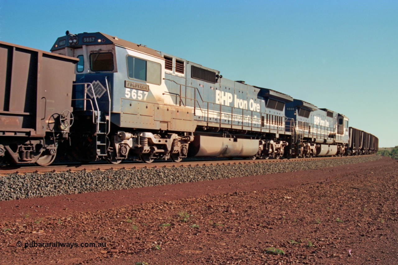 229-06
Yandi Two at the 311.5 km with an empty BHP train heading for the loadout behind mid-train Goninan rebuild CM40-8M GE units 5657 'Fukuyama' serial 8412-02 / 94-148 trailing lead remote sister unit 5660. [url=https://goo.gl/maps/DcycDGojcBt]GeoData[/url].
Keywords: 5657;Goninan;GE;CM40-8M;8412-02/94-148;rebuild;Comeng-NSW;ALCo;M636C;5492;C6084-8;