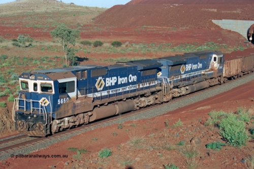 229-29
Yandi Two loadout exit side, Goninan rebuild CM40-8M GE units 5650 'Yawata' serial 8412-07 / 93-141 and sister unit 5642 drag a loading train at 1.2 km/h, both units carry the BHP Iron Ore teal and marigold livery for the logo. [url=https://goo.gl/maps/KQ3dQNrTwd42]GeoData[/url].
Keywords: 5650;Goninan;GE;CM40-8M;8412-07/93-141;rebuild;AE-Goodwin;ALCo;M636C;5481;G6061-2;
