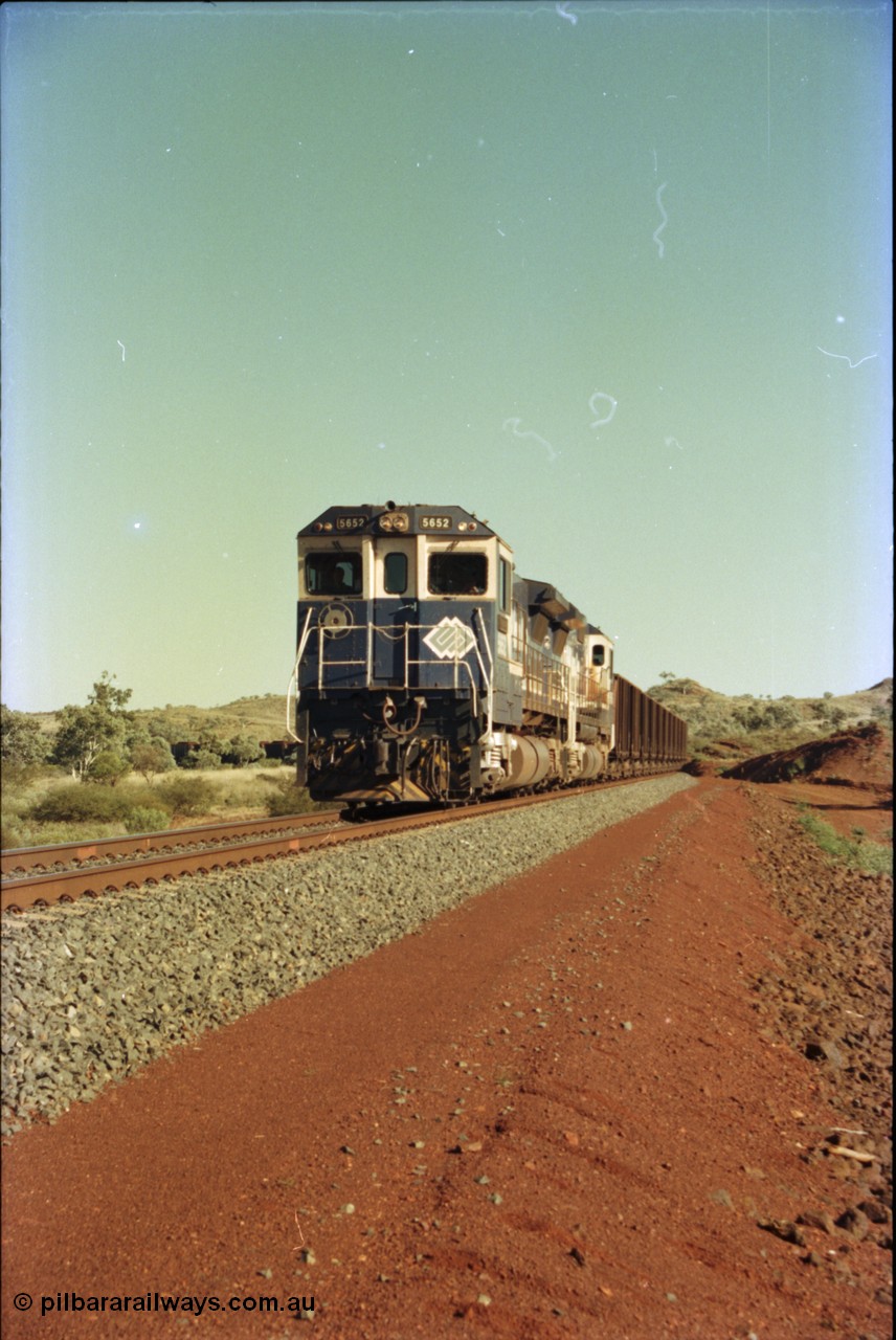 231-07
Yandi Two balloon loop, BHP Iron Ore 5652 'Villanueva' serial 8412-09 / 93-143 an Goninan WA rebuild CM40-8M GE unit loads a train at 1.2 km/h with second unit 5650. [url=https://goo.gl/maps/3vQHZqBXNa32]GeoData[/url].
Keywords: 5652;Goninan;GE;CM40-8M;8412-09/93-143;rebuild;AE-Goodwin;ALCo;M636C;5482;G6061-3;