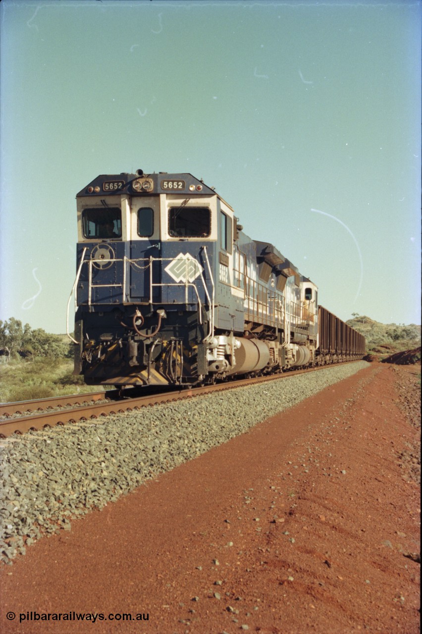 231-08
Yandi Two balloon loop, BHP Iron Ore 5652 'Villanueva' serial 8412-09 / 93-143 an Goninan WA rebuild CM40-8M GE unit loads a train at 1.2 km/h with second unit 5650. [url=https://goo.gl/maps/3vQHZqBXNa32]GeoData[/url].
Keywords: 5652;Goninan;GE;CM40-8M;8412-09/93-143;rebuild;AE-Goodwin;ALCo;M636C;5482;G6061-3;