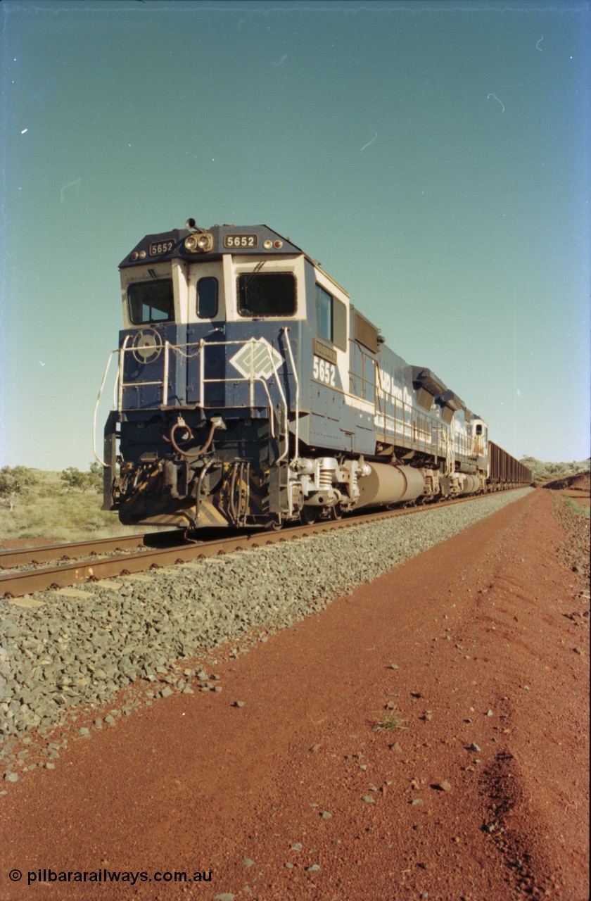 231-11
Yandi Two balloon loop, BHP Iron Ore 5652 'Villanueva' serial 8412-09 / 93-143 an Goninan WA rebuild CM40-8M GE unit loads a train at 1.2 km/h with second unit 5650. [url=https://goo.gl/maps/3vQHZqBXNa32]GeoData[/url].
Keywords: 5652;Goninan;GE;CM40-8M;8412-09/93-143;rebuild;AE-Goodwin;ALCo;M636C;5482;G6061-3;