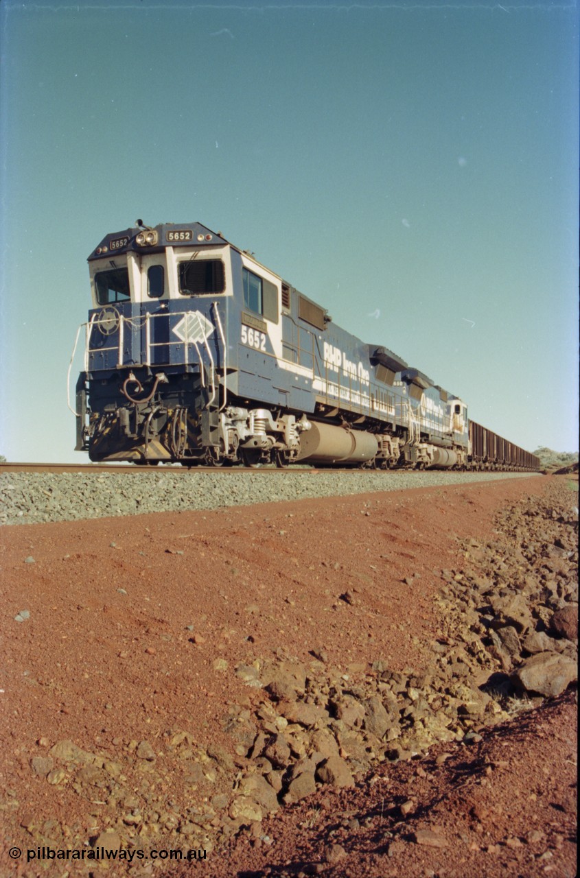 231-13
Yandi Two balloon loop, BHP Iron Ore 5652 'Villanueva' serial 8412-09 / 93-143 an Goninan WA rebuild CM40-8M GE unit loads a train at 1.2 km/h with second unit 5650. [url=https://goo.gl/maps/3vQHZqBXNa32]GeoData[/url].
Keywords: 5652;Goninan;GE;CM40-8M;8412-09/93-143;rebuild;AE-Goodwin;ALCo;M636C;5482;G6061-3;