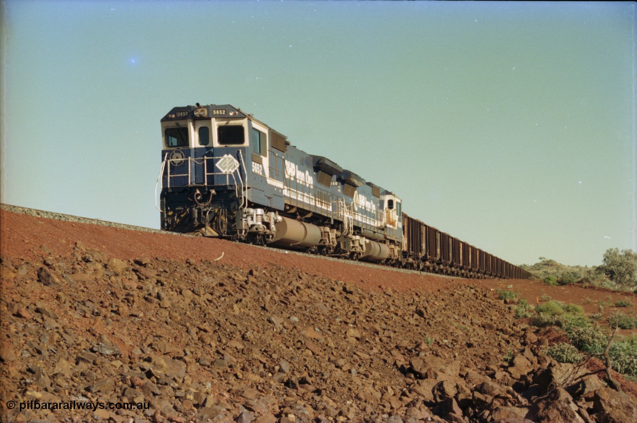 231-18
Yandi Two balloon loop, BHP Iron Ore 5652 'Villanueva' serial 8412-09 / 93-143 an Goninan WA rebuild CM40-8M GE unit loads a train at 1.2 km/h with second unit 5650. [url=https://goo.gl/maps/3vQHZqBXNa32]GeoData[/url].
Keywords: 5652;Goninan;GE;CM40-8M;8412-09/93-143;rebuild;AE-Goodwin;ALCo;M636C;5482;G6061-3;