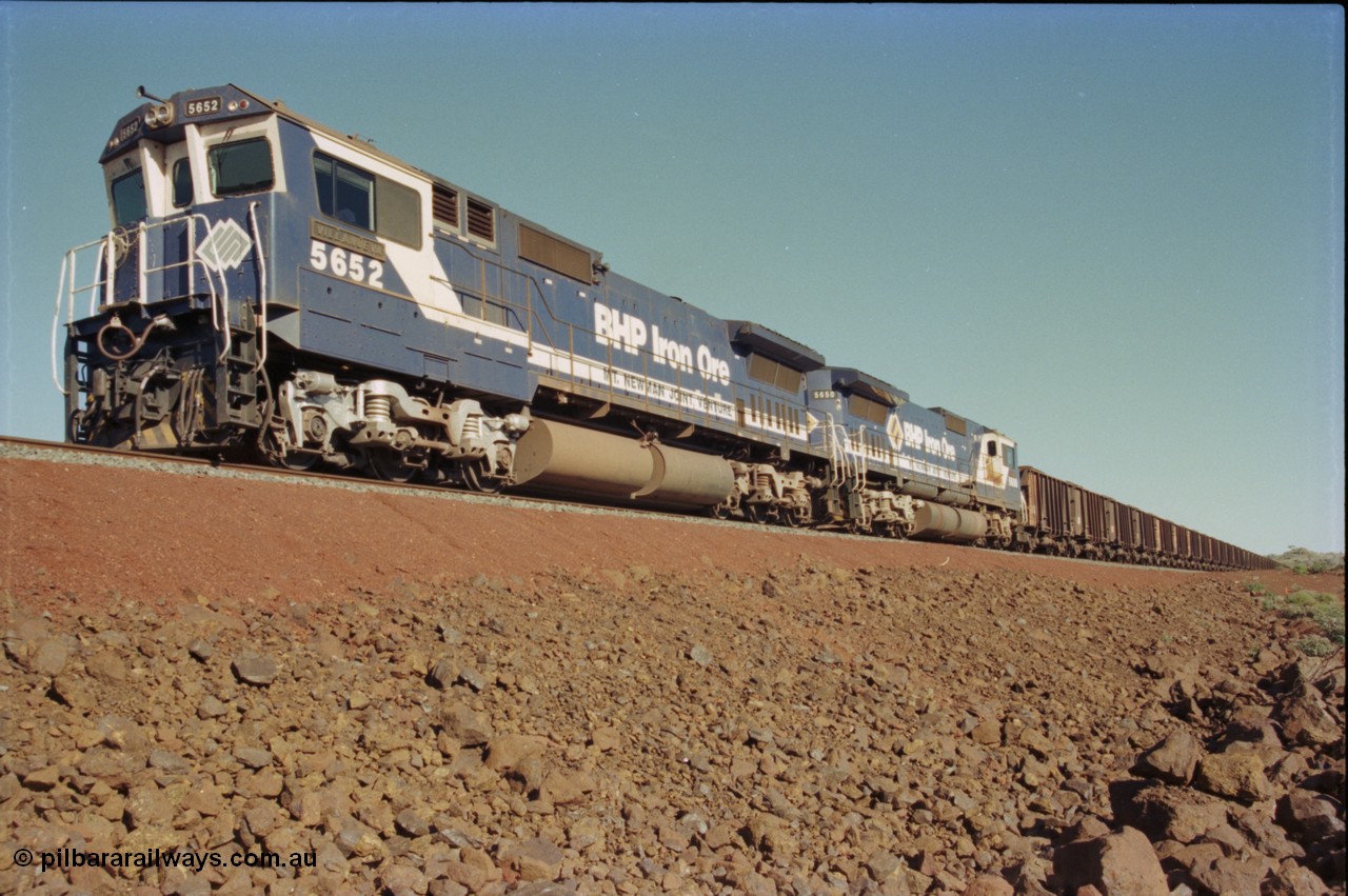 231-21
Yandi Two balloon loop, BHP Iron Ore 5652 'Villanueva' serial 8412-09 / 93-143 an Goninan WA rebuild CM40-8M GE unit loads a train at 1.2 km/h with second unit 5650. [url=https://goo.gl/maps/3vQHZqBXNa32]GeoData[/url].
Keywords: 5652;Goninan;GE;CM40-8M;8412-09/93-143;rebuild;AE-Goodwin;ALCo;M636C;5482;G6061-3;