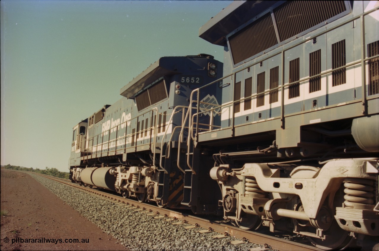 231-22
Yandi Two balloon loop, BHP Iron Ore 5652 'Villanueva' serial 8412-09 / 93-143 an Goninan WA rebuild CM40-8M GE unit loads a train at 1.2 km/h, note the silver logo on the rear and the missing logo from the hood, the round style fuel tanks tells us this units was rebuilt from an AE Goodwin built M636 ALCo. [url=https://goo.gl/maps/3vQHZqBXNa32]GeoData[/url].
Keywords: 5652;Goninan;GE;CM40-8M;8412-09/93-143;rebuild;AE-Goodwin;ALCo;M636C;5482;G6061-3;