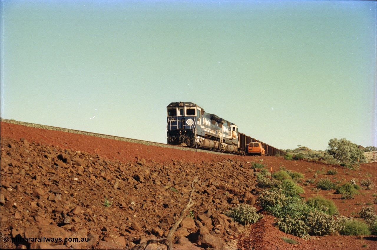 231-25
Yandi Two balloon loop, BHP Iron Ore 5652 'Villanueva' serial 8412-09 / 93-143 an Goninan WA rebuild CM40-8M GE unit loads a train at 1.2 km/h with second unit 5650 as the outgoing crew arrive to change out. [url=https://goo.gl/maps/3vQHZqBXNa32]GeoData[/url].
Keywords: 5652;Goninan;GE;CM40-8M;8412-09/93-143;rebuild;AE-Goodwin;ALCo;M636C;5482;G6061-3;