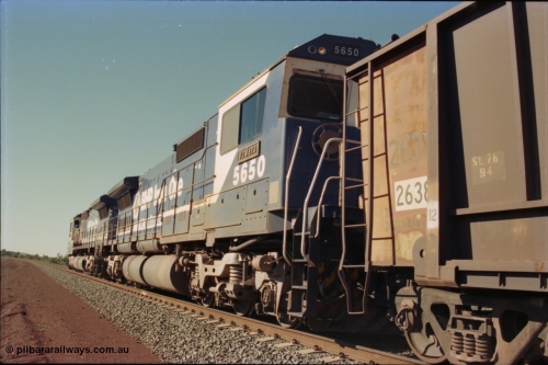 231-23
Yandi Two balloon loop, BHP Iron Ore 5650 'Yawata' serial 8412-09 / 93-141 an Goninan WA rebuild CM40-8M GE unit loads a train at 1.2 km/h as second unit, note the logos are the original teal and marigold and the round style fuel tanks tells us this units was rebuilt from an AE Goodwin built M636 ALCo. [url=https://goo.gl/maps/3vQHZqBXNa32]GeoData[/url].
Keywords: 5650;Goninan;GE;CM40-8M;8412-07/93-141;rebuild;AE-Goodwin;ALCo;M636C;5481;G6061-2;