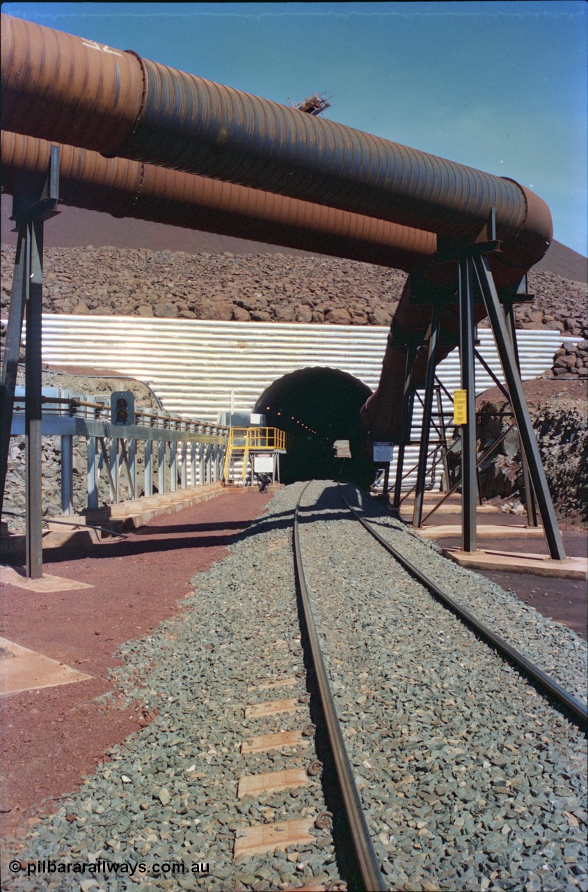 232-01
Yandi Two entry portal for the loadout tunnel with dust extraction pipes. February 1997. [url=https://goo.gl/maps/uMdxcaCKSdm]GeoData[/url].
