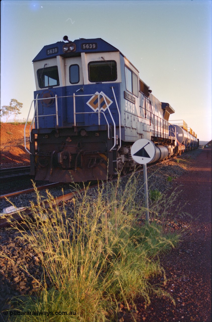 232-12
Yandi One backtrack, following a cyclone shutdown of the mainline and severe flooding around Yandi a 'mixed' freight train was operated to Yandi to deliver food, mail and diesel fuel to the mine and camp. Here BHP Iron Ore CM40-8M unit 5639 'Corunna Downs' serial 8281-03 / 92-128 idles away in the backtrack awaiting its path back to Port Hedland with flat waggon 6703, four fuel tank waggons and a broken ore waggon. February 1997. [url=https://goo.gl/maps/6c1WFqjYSg42]GeoData[/url].
Keywords: 5639;Goninan;GE;CM40-8M;8281-03/92-128;rebuild;AE-Goodwin;ALCo;C636;5459;G6027-3;