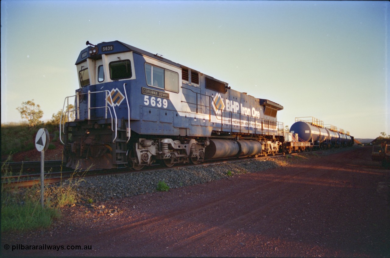 232-16
Yandi One backtrack, following a cyclone shutdown of the mainline and severe flooding around Yandi a 'mixed' freight train was operated to Yandi to deliver food, mail and diesel fuel to the mine and camp. Here BHP Iron Ore CM40-8M unit 5639 'Corunna Downs' serial 8281-03 / 92-128 idles away in the backtrack awaiting its path back to Port Hedland with flat waggon 6703, four fuel tank waggons and a broken ore waggon. February 1997. [url=https://goo.gl/maps/6c1WFqjYSg42]GeoData[/url].
Keywords: 5639;Goninan;GE;CM40-8M;8281-03/92-128;rebuild;AE-Goodwin;ALCo;C636;5459;G6027-3;