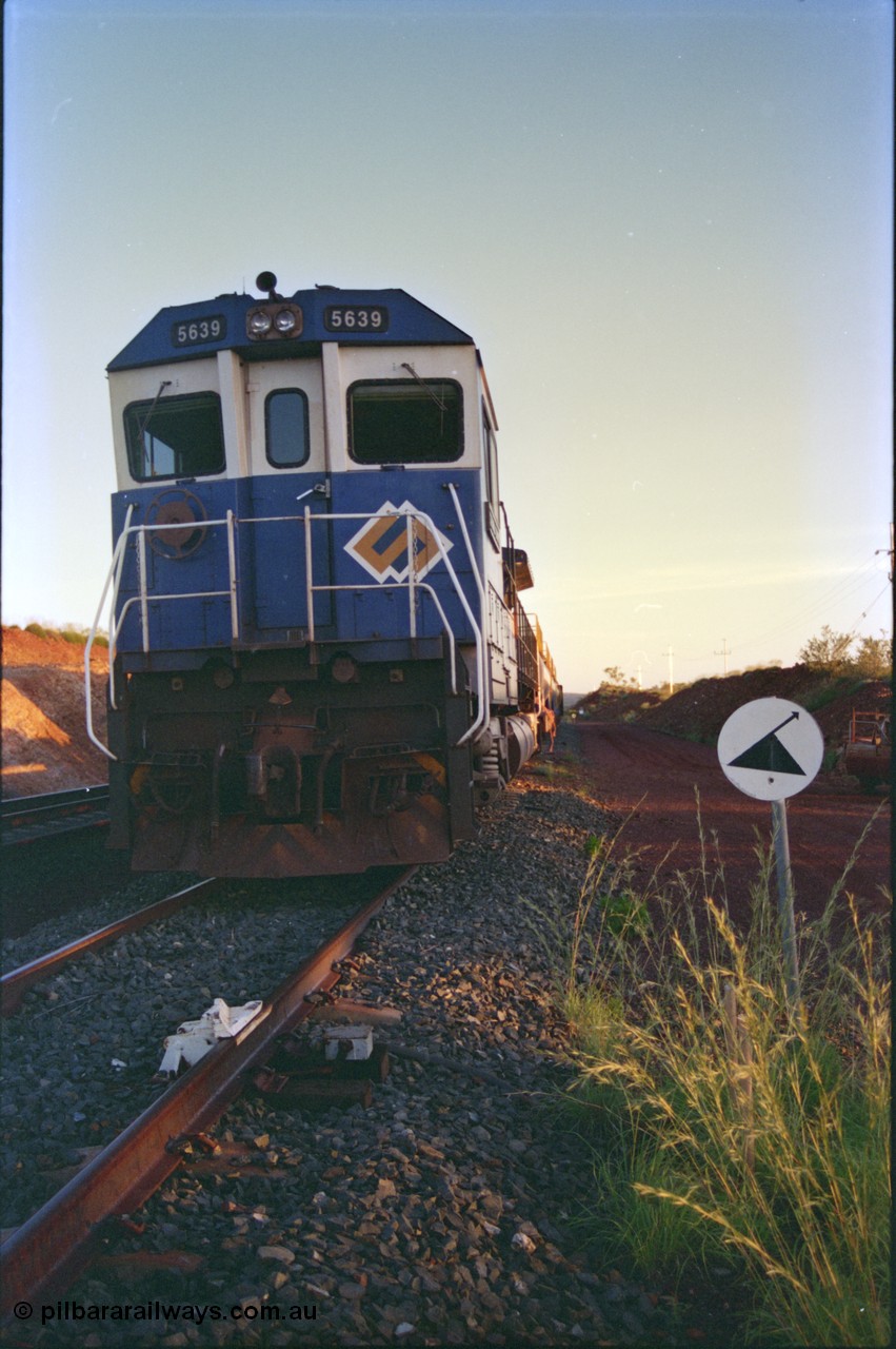 232-17
Yandi One backtrack, following a cyclone shutdown of the mainline and severe flooding around Yandi a 'mixed' freight train was operated to Yandi to deliver food, mail and diesel fuel to the mine and camp. Here BHP Iron Ore CM40-8M unit 5639 'Corunna Downs' serial 8281-03 / 92-128 idles away in the backtrack awaiting its path back to Port Hedland with flat waggon 6703, four fuel tank waggons and a broken ore waggon. February 1997. [url=https://goo.gl/maps/6c1WFqjYSg42]GeoData[/url].
Keywords: 5639;Goninan;GE;CM40-8M;8281-03/92-128;rebuild;AE-Goodwin;ALCo;C636;5459;G6027-3;