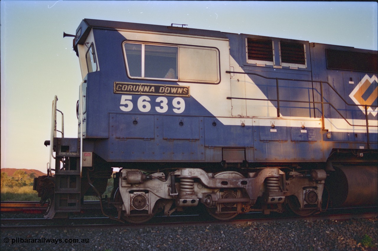 232-18
Yandi One backtrack, following a cyclone shutdown of the mainline and severe flooding around Yandi a 'mixed' freight train was operated to Yandi to deliver food, mail and diesel fuel to the mine and camp. Here BHP Iron Ore CM40-8M unit 5639 'Corunna Downs' serial 8281-03 / 92-128 idles away in the backtrack awaiting its path back to Port Hedland with flat waggon 6703, four fuel tank waggons and a broken ore waggon. February 1997. [url=https://goo.gl/maps/6c1WFqjYSg42]GeoData[/url].
Keywords: 5639;Goninan;GE;CM40-8M;8281-03/92-128;rebuild;AE-Goodwin;ALCo;C636;5459;G6027-3;