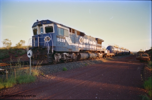 232-11
Yandi One backtrack, following a cyclone shutdown of the mainline and severe flooding around Yandi a 'mixed' freight train was operated to Yandi to deliver food, mail and diesel fuel to the mine and camp. Here BHP Iron Ore CM40-8M unit 5639 'Corunna Downs' serial 8281-03 / 92-128 idles away in the backtrack awaiting its path back to Port Hedland with flat waggon 6703, four fuel tank waggons and a broken ore waggon. February 1997. [url=https://goo.gl/maps/6c1WFqjYSg42]GeoData[/url].
Keywords: 5639;Goninan;GE;CM40-8M;8281-03/92-128;rebuild;AE-Goodwin;ALCo;C636;5459;G6027-3;