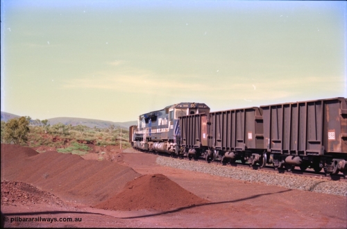 232-23
Yandi One balloon loop, as a train is being loaded the mid-train remotes approach, waggons are standard Comeng WA builds. 18th of February 1997. [url=https://goo.gl/maps/qrCg6FjBfS22]GeoData[/url].
