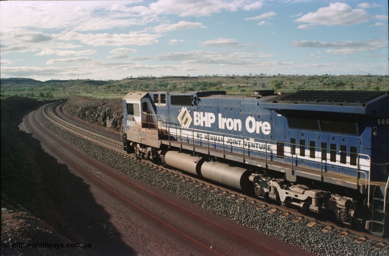 233-31
Yandi Two loaded car side of load-out tunnel, a loading train lead by BHP Iron Ore's Goninan rebuild CM40-8M GE unit 5650 'Yawata' serial 8412-07 / 93-141 as it drags the train through at 1.2 km/h. [url=https://goo.gl/maps/gXRbfYH9U482]GeoData[/url].
Keywords: 5650;Goninan;GE;CM40-8M;8412-07/93-141;rebuild;AE-Goodwin;ALCo;M636C;5481;G6061-2;