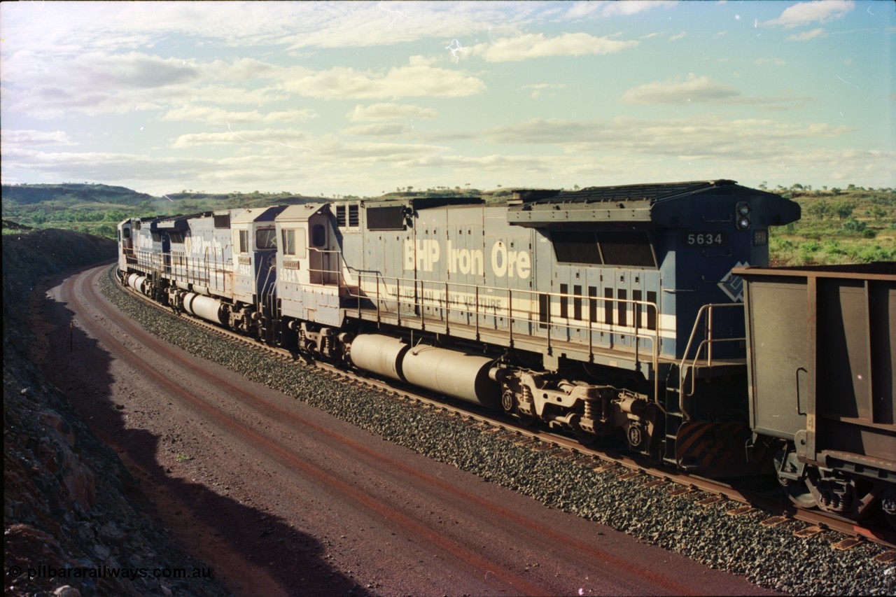 233-34
Yandi Two, BHP Iron Ore's Goninan rebuild CM40-8M GE unit 5634 'Boodarie' serial 8151-07 / 91-120 shows the ALCo heritage from the frame down and is wearing the teal and marigold logo. 5634 was the first CM40-8M rebuild for BHP. [url=https://goo.gl/maps/gXRbfYH9U482]GeoData[/url].
Keywords: 5634;Goninan;GE;CM40-8M;8151-07/91-120;rebuild;AE-Goodwin;ALCo;C636;5457;G6027-1;