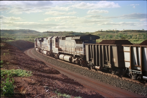 233-37
Yandi Two, BHP Iron Ore's Goninan rebuild CM40-8M GE unit 5634 'Boodarie' serial 8151-07 / 91-120 shows the ALCo heritage from the frame down and is wearing the teal and marigold logo. 5634 was the first CM40-8M rebuild for BHP. [url=https://goo.gl/maps/gXRbfYH9U482]GeoData[/url].
Keywords: 5634;Goninan;GE;CM40-8M;8151-07/91-120;rebuild;AE-Goodwin;ALCo;C636;5457;G6027-1;