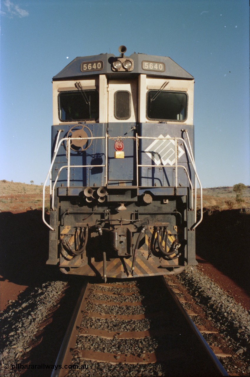 234-01
Yandi Two, BHP Iron Ore Goninan rebuild CM40-8M GE unit 5640 'Ethel Creek' serial 8281-05 / 92-129 is on the rear of a 240 waggon loaded train, this configuration was trialled for a time with two Dash 8 locos, 120 waggons, Dash 8, 120 waggons and Dash 8. As this series of rebuilds has no marker lights not the red lantern attached to the hand rail. Circa 1998.
Keywords: 5640;Goninan;GE;CM40-8M;8281-05/92-129;rebuild;AE-Goodwin;ALCo;M636C;5479;G6047-11;