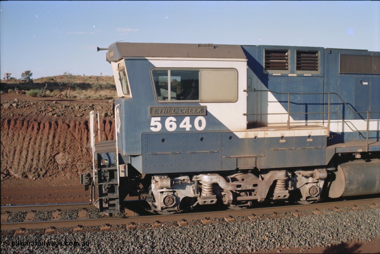 234-06
Yandi Two, BHP Iron Ore Goninan rebuild CM40-8M GE unit 5640 'Ethel Creek' serial 8281-05 / 92-129 is on the rear of a 240 waggon loaded train, this configuration was trialled for a time with two Dash 8 locos, 120 waggons, Dash 8, 120 waggons and Dash 8. View of left hand side of cab. Circa 1998.
Keywords: 5640;Goninan;GE;CM40-8M;8281-05/92-129;rebuild;AE-Goodwin;ALCo;M636C;5479;G6047-11;