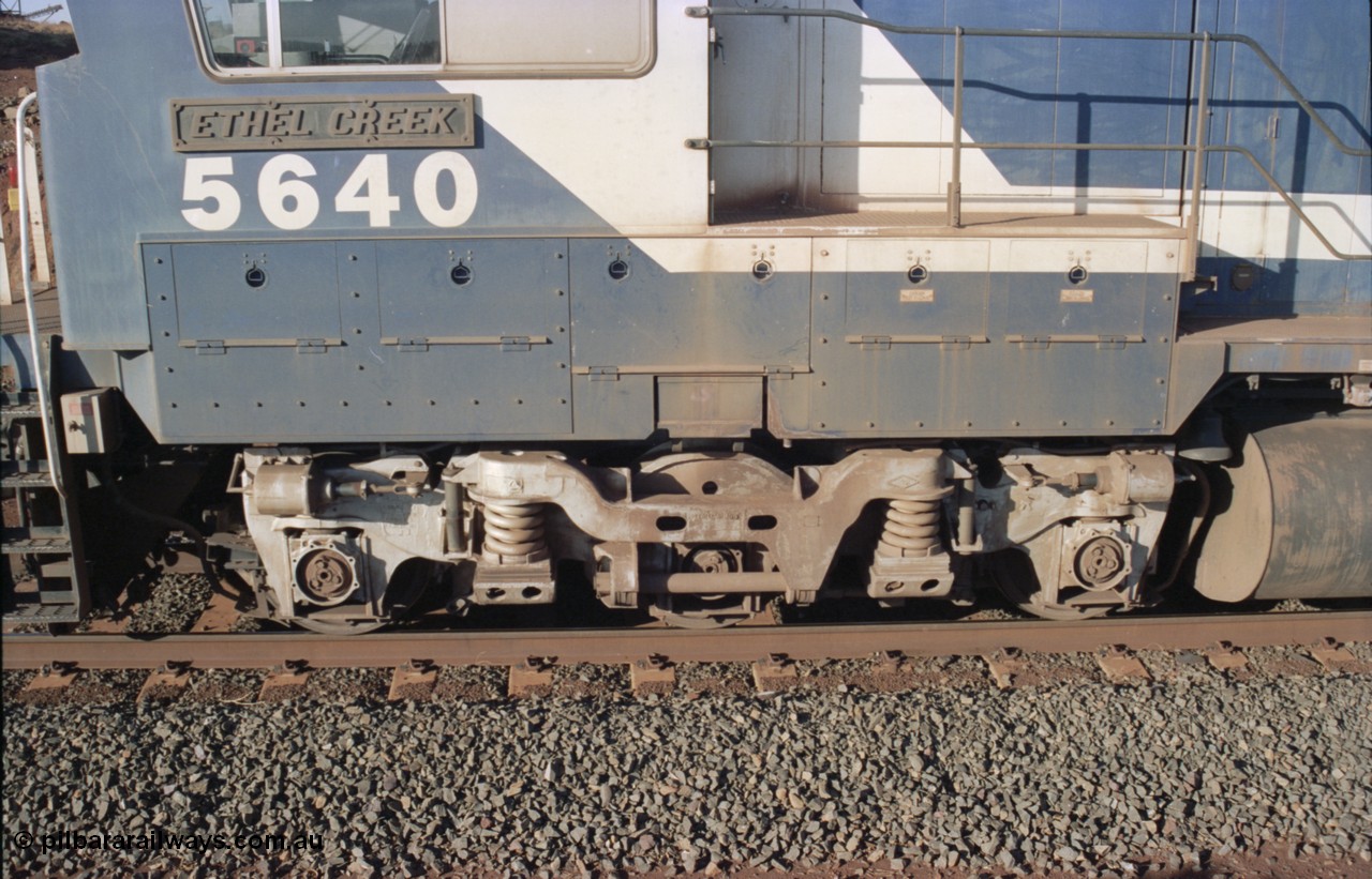 234-08
Yandi Two, BHP Iron Ore Goninan rebuild CM40-8M GE unit 5640 'Ethel Creek' serial 8281-05 / 92-129 is on the rear of a 240 waggon loaded train, this configuration was trialled for a time with two Dash 8 locos, 120 waggons, Dash 8, 120 waggons and Dash 8. View of left hand side leading bogie. Circa 1998.
Keywords: 5640;Goninan;GE;CM40-8M;8281-05/92-129;rebuild;AE-Goodwin;ALCo;M636C;5479;G6047-11;