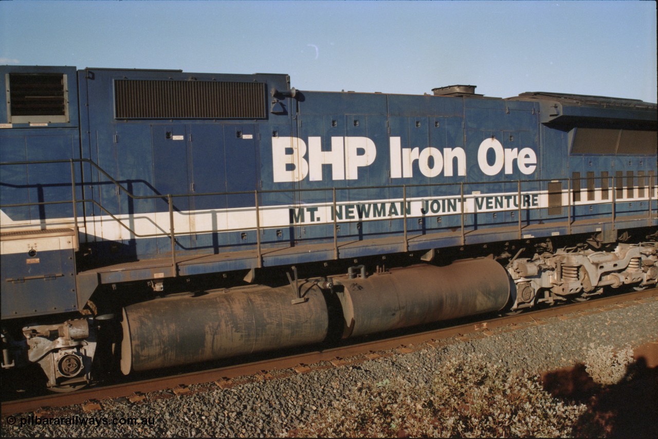 234-09
Yandi Two, BHP Iron Ore Goninan rebuild CM40-8M GE unit 5640 'Ethel Creek' serial 8281-05 / 92-129 is on the rear of a 240 waggon loaded train, this configuration was trialled for a time with two Dash 8 locos, 120 waggons, Dash 8, 120 waggons and Dash 8. View of engine hood and fuel tank. Circa 1998.
Keywords: 5640;Goninan;GE;CM40-8M;8281-05/92-129;rebuild;AE-Goodwin;ALCo;M636C;5479;G6047-11;