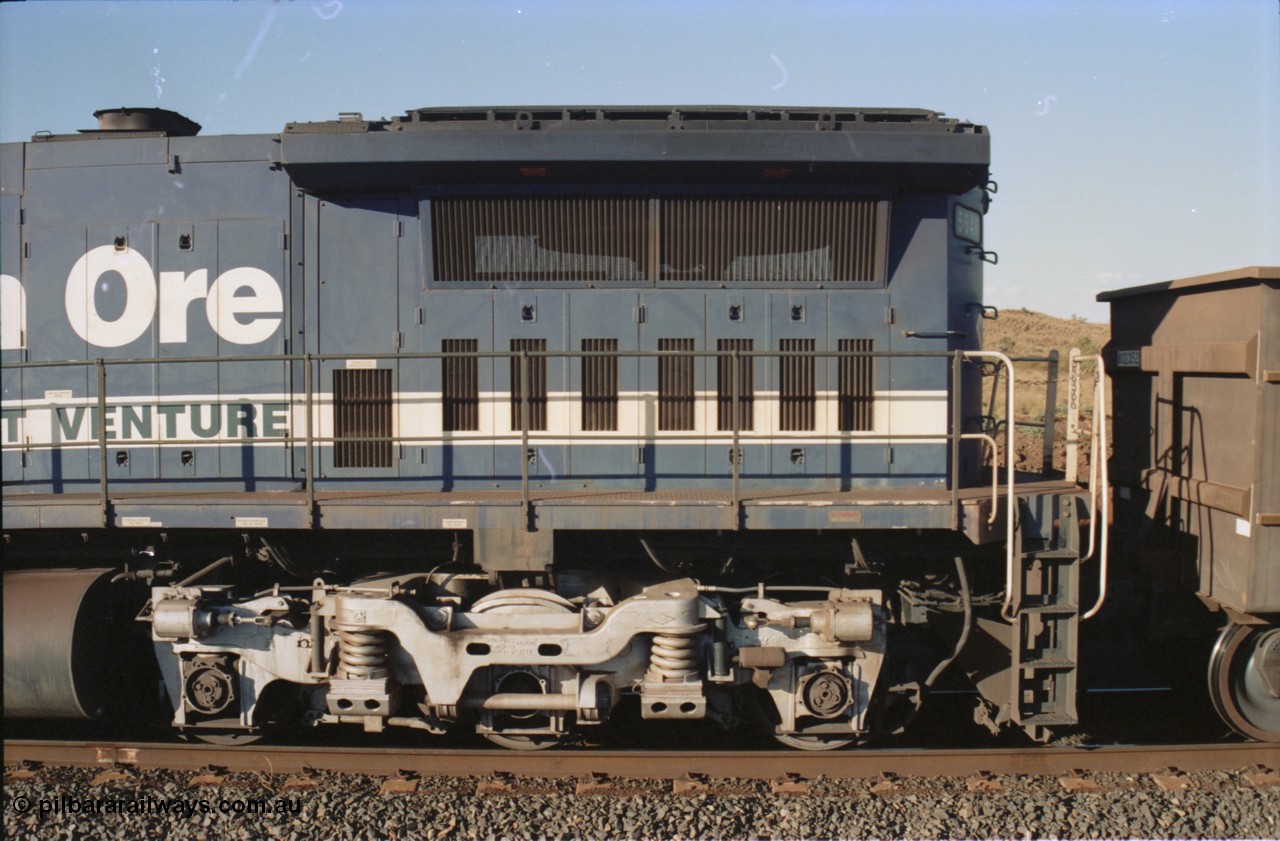 234-10
Yandi Two, BHP Iron Ore Goninan rebuild CM40-8M GE unit 5640 'Ethel Creek' serial 8281-05 / 92-129 is on the rear of a 240 waggon loaded train, this configuration was trialled for a time with two Dash 8 locos, 120 waggons, Dash 8, 120 waggons and Dash 8. View of left hand side radiator section. Circa 1998.
Keywords: 5640;Goninan;GE;CM40-8M;8281-05/92-129;rebuild;AE-Goodwin;ALCo;M636C;5479;G6047-11;