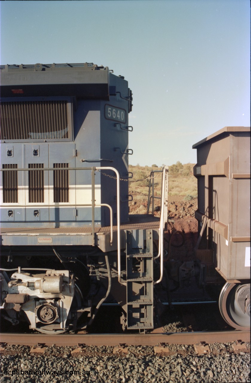 234-11
Yandi Two, BHP Iron Ore Goninan rebuild CM40-8M GE unit 5640 'Ethel Creek' serial 8281-05 / 92-129 is on the rear of a 240 waggon loaded train, this configuration was trialled for a time with two Dash 8 locos, 120 waggons, Dash 8, 120 waggons and Dash 8. View of left hand side rear end and coupling to waggon. Circa 1998.
Keywords: 5640;Goninan;GE;CM40-8M;8281-05/92-129;rebuild;AE-Goodwin;ALCo;M636C;5479;G6047-11;