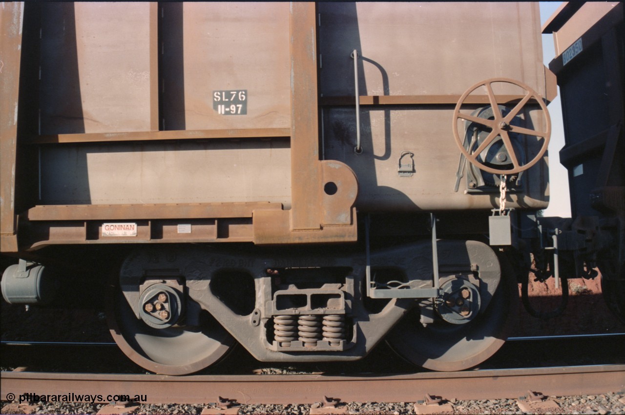 234-12
Yandi Two, loaded BHP Iron Ore waggon #4316 a Goninan built 3CR12 style stainless steel construction from 1997. Handbrake and bogie view.
Keywords: 4316;United-Goninan-WA;BHP-ore-waggon;